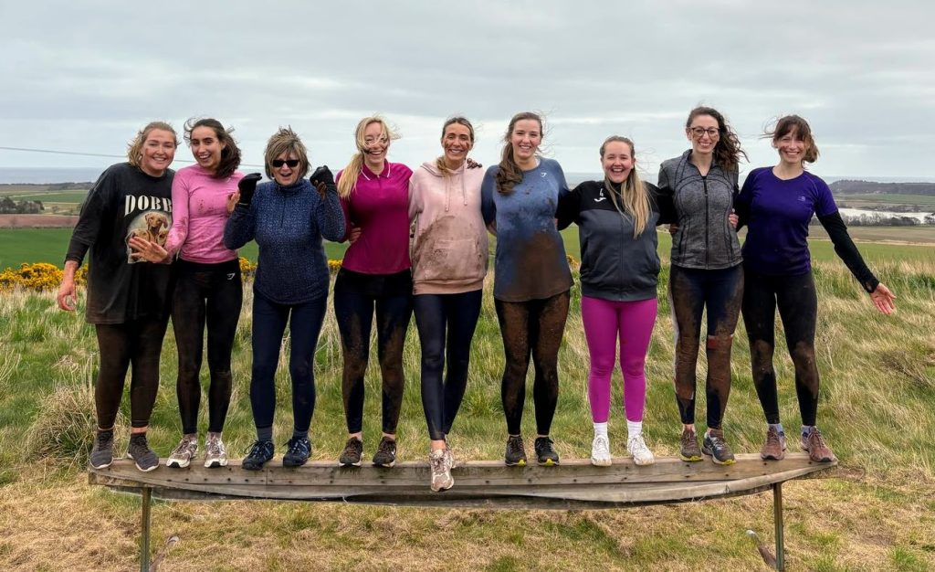 Hen Group activity participants standing together at Wild Cairns outdoor centre