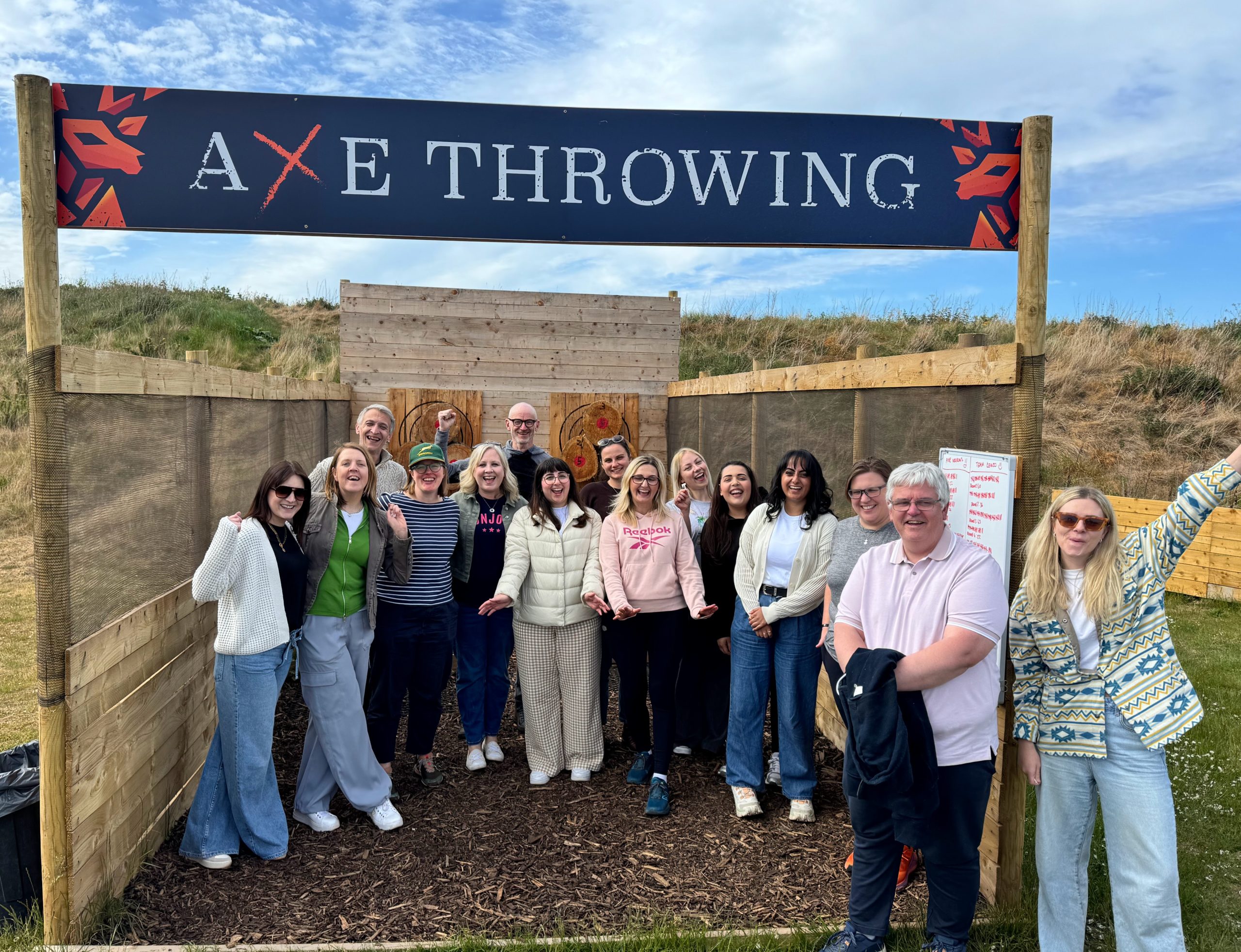 A group enjoying axe throwing at Wild Cairns