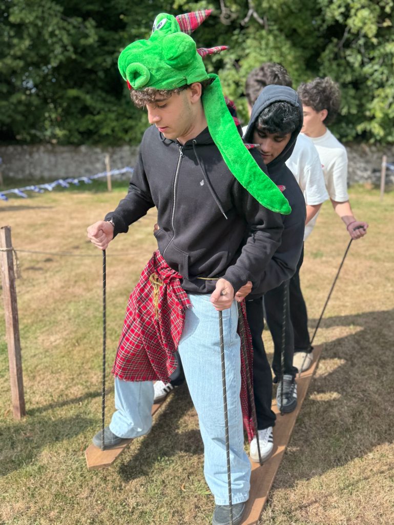 Team taking part in the Alpine Ski challenge at a Wild Cairns Mobile Highland Games